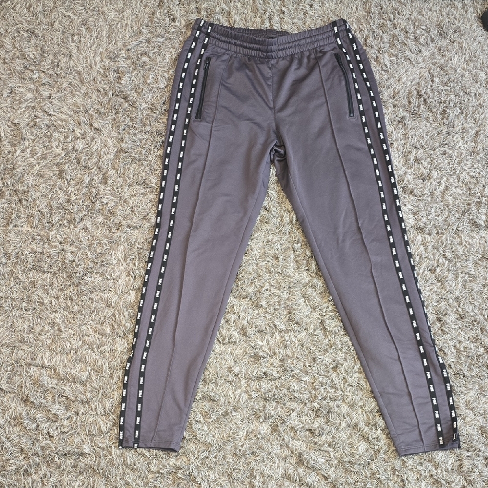 Gray Track Pants with Side Stripes with the word pink